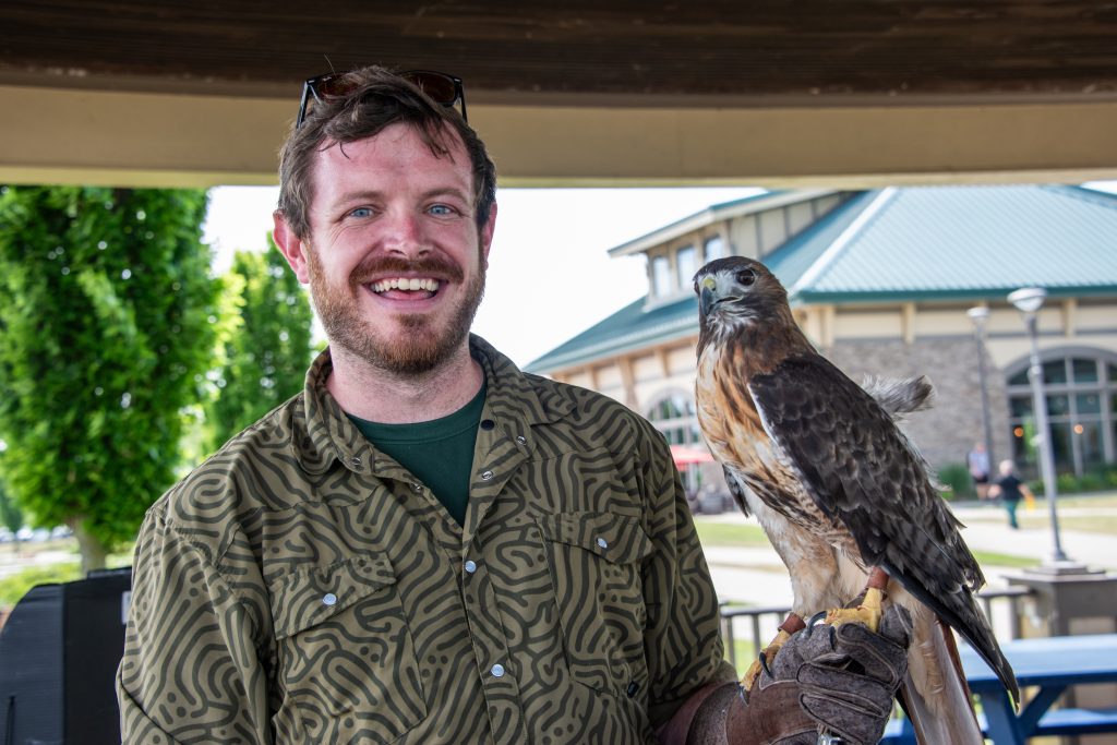 a man holding a bird