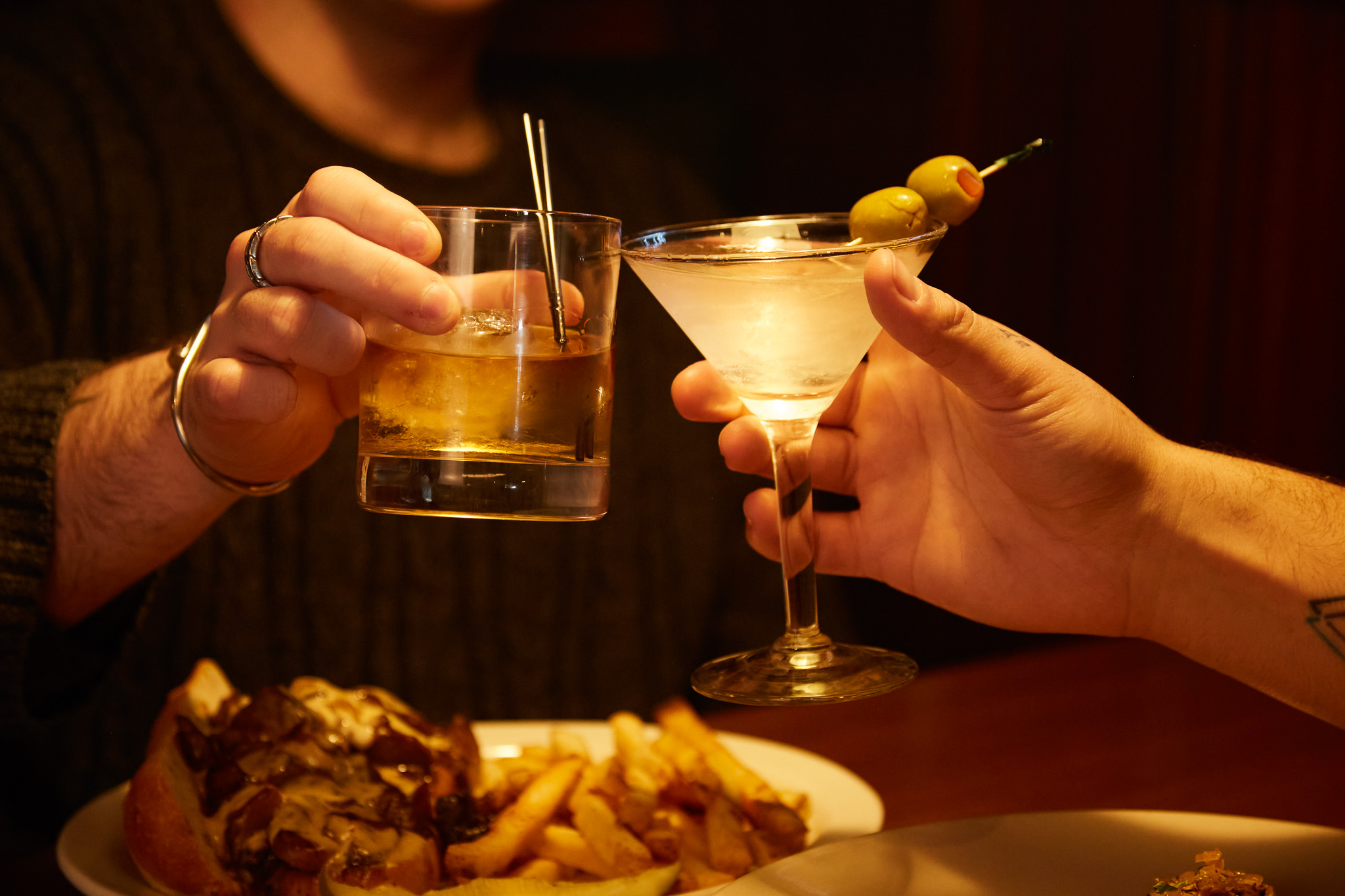 Cheers with drinks and food at Fargo Bar and Grill in Aurora, New York.