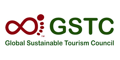 a logo with green letters and red dots