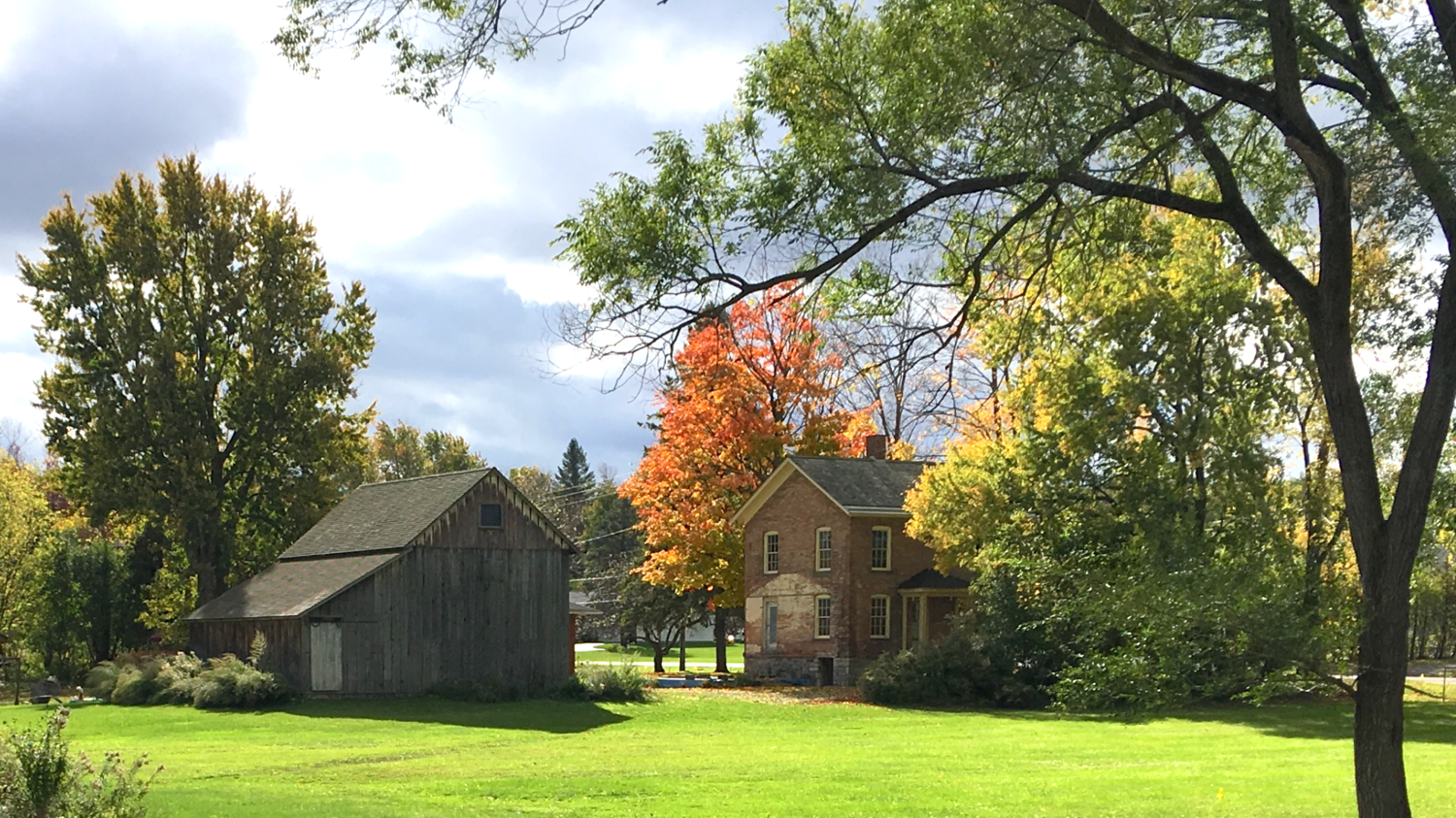 Walk in Their Footsteps: Women’s History Month in New York’s Finger Lakes Historic house surrounded by colorful trees