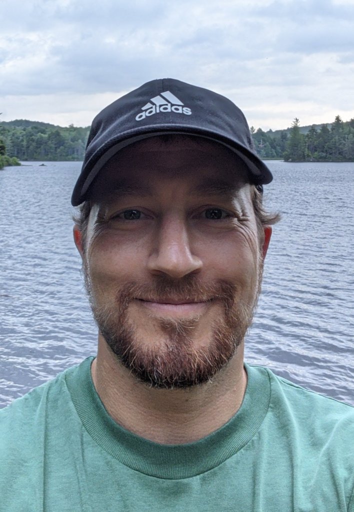 Find Hidden Gems of the Finger Lakes Region - Visit a State Park or State Forest a man taking a selfie in front of a lake
