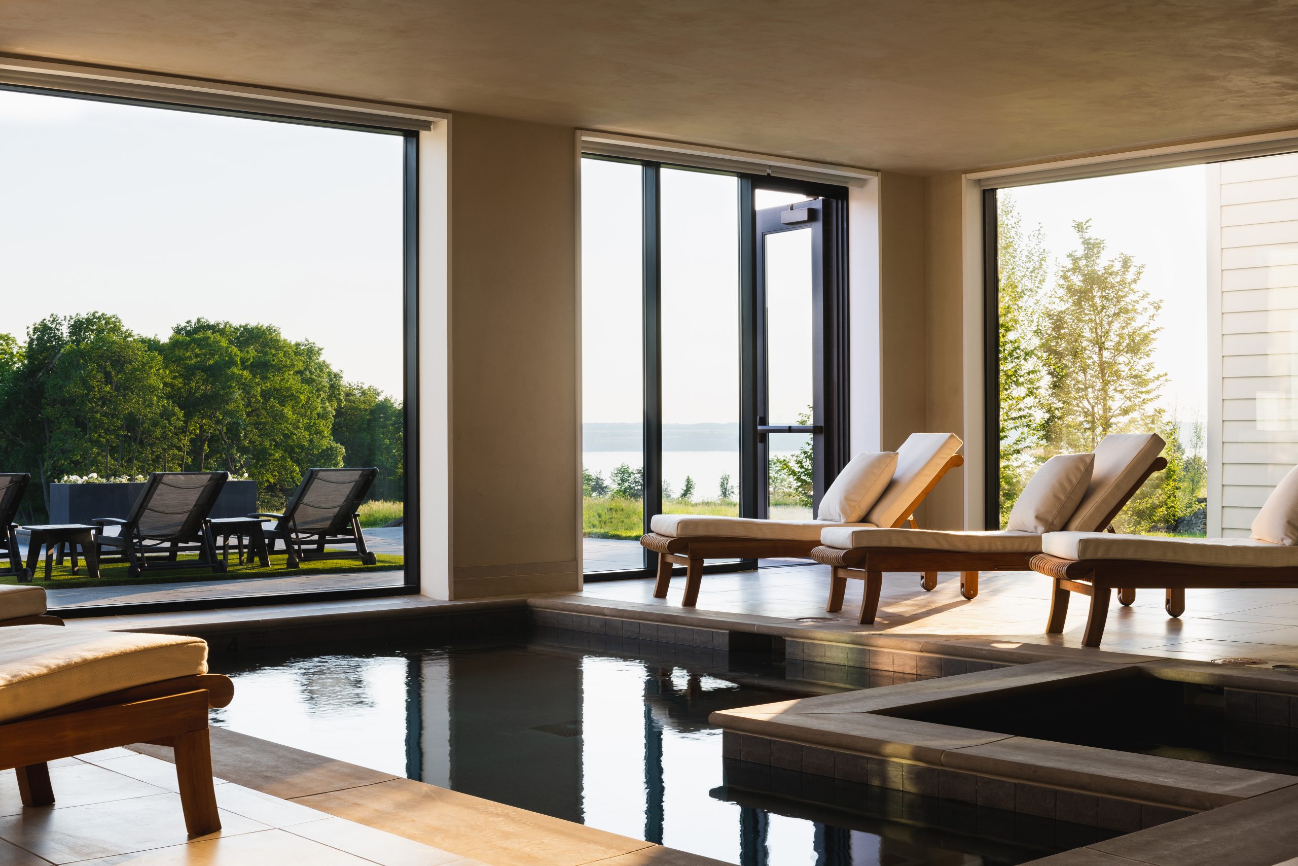 Spa room with pool and view at Inns of Aurora in Finger Lakes.